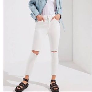 White jeans with ripped knees